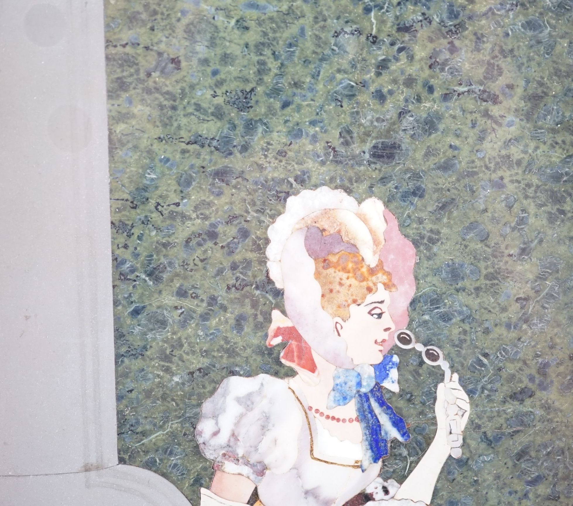 An early 20th century Italian pietra dura plaque depicting an elegant lady, 15 cms wide x 26.5 high, 26 x 15cm